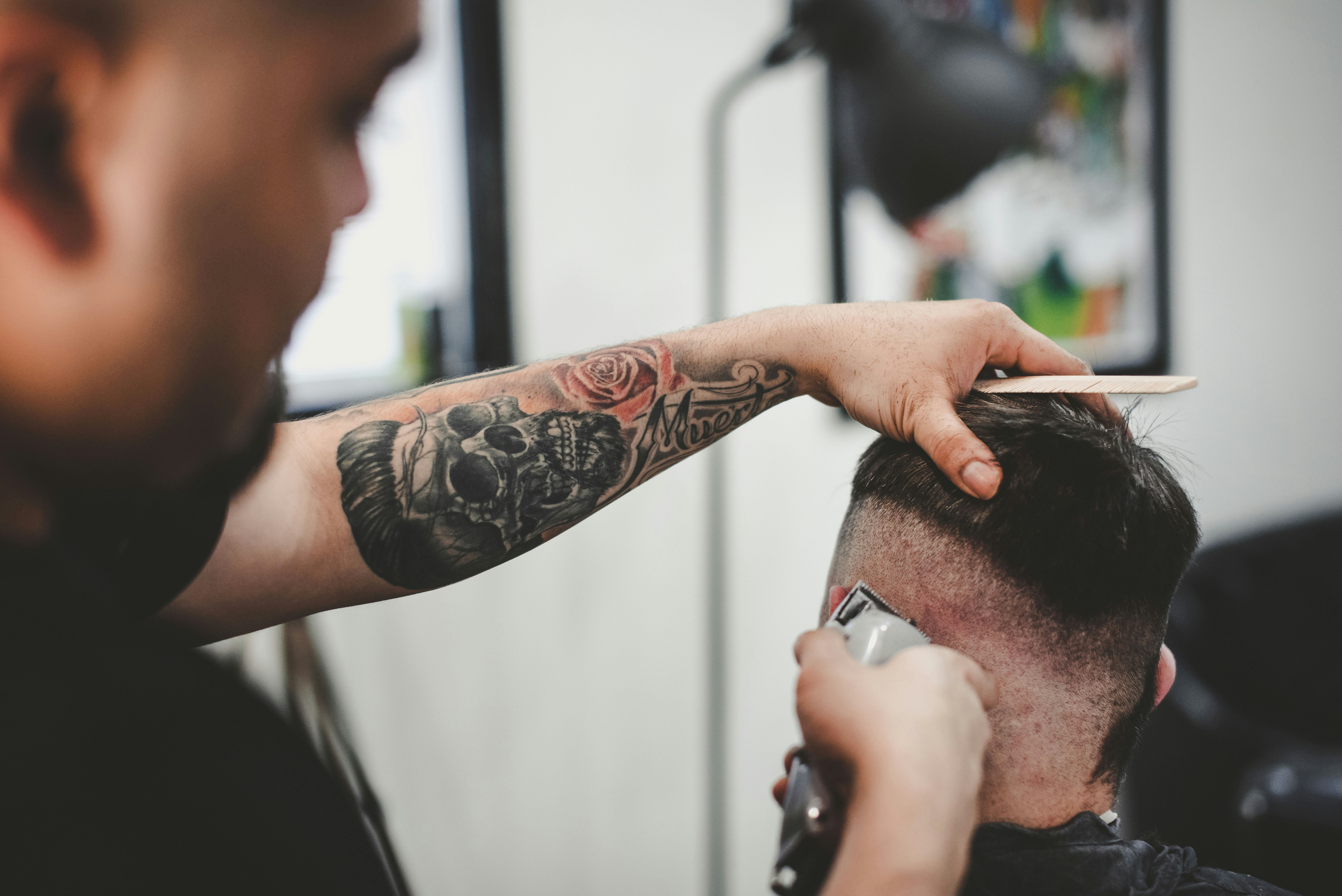 A barber cutting a client's hair